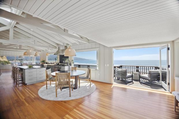 Open living room/kitchen overlooking Pacific. 