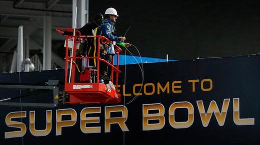 Sign installers continue dolling up Levi's Stadium with Super Bowl 50 signage on Tuesday, Jan. 12, 2016, in Santa Clara, Calif. (Karl Mondon/Bay Area News Group)