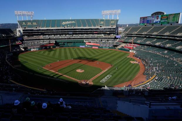 Fans watch a game at Oakland Coliseum between the Athletics and Rangers on July 23, 2022. The Athletics have signed a binding agreement to purchase land for a new retractable roof stadium in Las Vegas after being unable to build a new venue in the Bay Area. (Jeff Chiu, AP)