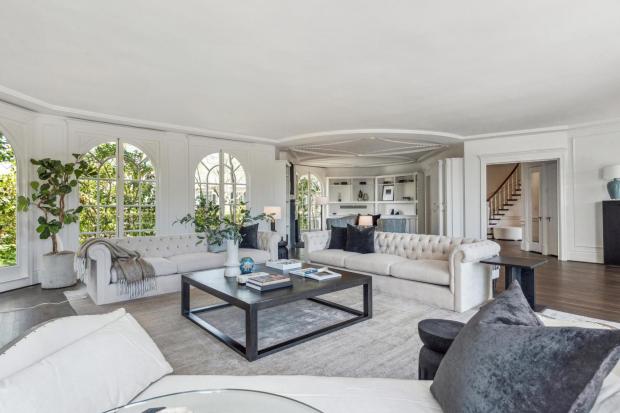 Living room with arched windows.