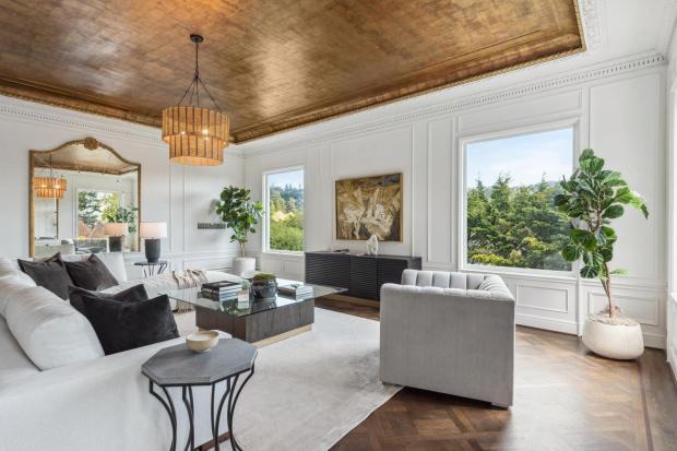 Living room with gold colored ceiling.