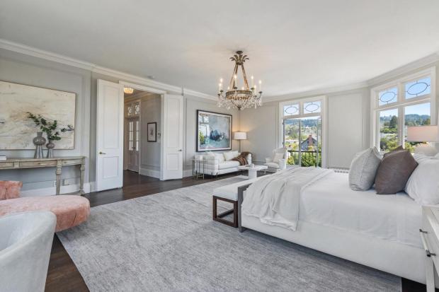 Bedroom with chandelier.