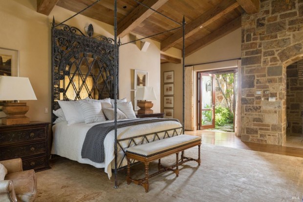 Bedroom with beamed ceilings.