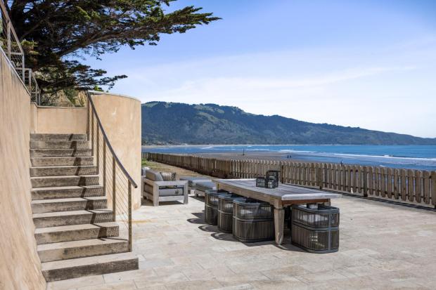 Outdoor patio with view of ocean.