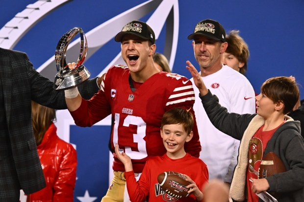 San Francisco 49ers quarterback Brock Purdy (13) celebrates while holding The George Halas trophy after winning the NFC Championship Game at Levi's Stadium in Santa Clara, Calif., on Sunday, Jan. 28, 2024. The San Francisco 49ers defeated the Detroit Lions 34-31. (Jose Carlos Fajardo/Bay Area News Group)