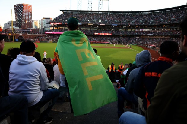 San Francisco Giants and Oakland Athletics fans watch the game in the sixth inning of the Bay Bridge series at Oracle Park in San Francisco, Calif., on Tuesday, July 25, 2023. (Ray Chavez/Bay Area News Group)