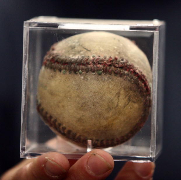 Jeff Fingerut holds a baseball that survived the fire at his sporting goods store West Coast Warehouse, Tuesday October 21, 2008. The 60-year-old sporting goods store setup shop at their warehouse location after their retail store burned down in August of 2007.(Anda Chu/The Argus)