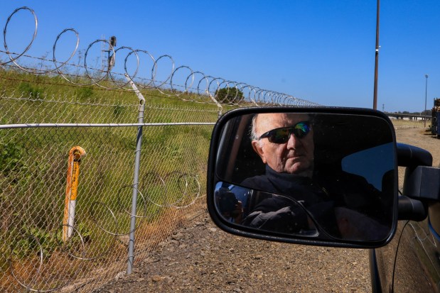 North Richmond Properties owner, Albert Engel Sr., looks towards a gas line that runs adjacent to the Richmond Rail Connector tracks and his property in Richmond, Calif., on Friday, April 19, 2024. (Ray Chavez/Bay Area News Group)