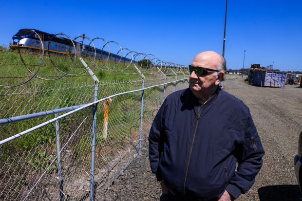 North Richmond Properties owner, Albert Engel Sr., shows a gas line that runs adjacent to the Richmond Rail Connector tracks and his property in Richmond, Calif., on Friday, April 19, 2024. (Ray Chavez/Bay Area News Group)