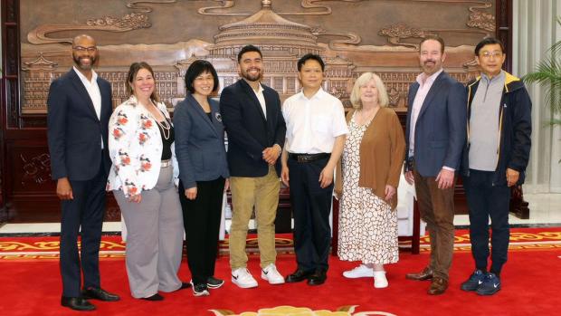 From left, Antioch Mayor Lamar Hernandez-Thorpe, Oakley Mayor Anissa Williams, Saratoga Mayor Yan Zhao, East Palo Alto Mayor Antonio Lopez, Li Mingquan of Chongqing's Foreign Affairs Office, Morgan Hill Mayor Pro Tem Marilyn Librers, San Carlos Mayor John Dugan, and Victor Wang, founder and chairman of China Silicon Valley in Hong Kong in May 2024. (Courtesy Lamar Hernandez-Thorpe)