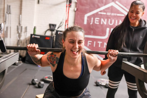 Katya Velichansky works out during a fitness class directed by coach and owner Jennifer Hernando, right, at her gym Jenuine Fitness in San Pablo, Calif., on Tuesday, May 7, 2024. Hernando is celebrating five years since her gym was founded. (Ray Chavez/Bay Area News Group)