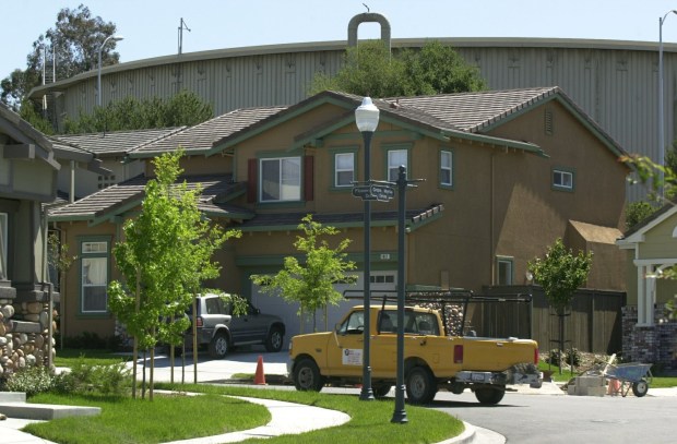 In 2004, steel tanks loom over brand new homes at a subdivision on the site of the old Pacific Refinery Co in Hercules. (Eddie Ledesma/Contra Costa Times Archives)