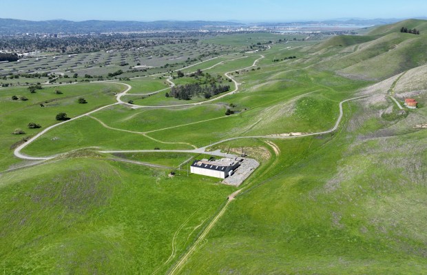 A drone view of undeveloped hills seen from Bailey Road in unincorporated Pittsburg, Calif., on Tuesday, April 9, 2024. There is a proposal to develop 1,500 residential units in the area. The former Concord Naval Weapons Station is to the left. (Jane Tyska/Bay Area News Group)