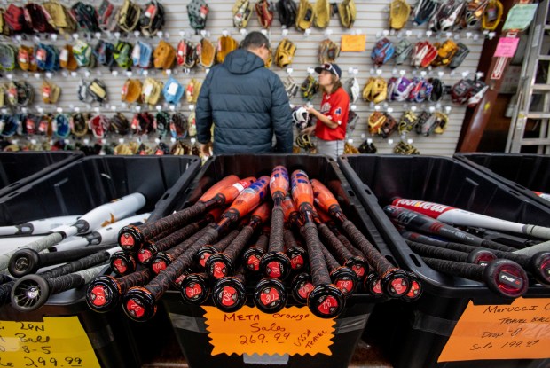 A young baseball player shops for a baseball glove at West Coast Sporting Goods in San Leandro, Calif., Saturday, Feb. 18, 2023. (Karl Mondon/Bay Area News Group)