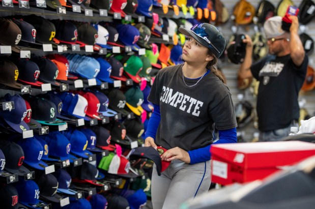 Andrea Tall, 15, shops for a baseball cap at West Coast Sporting Goods in San Leandro, Calif., Saturday, Feb. 18, 2023. (Karl Mondon/Bay Area News Group)