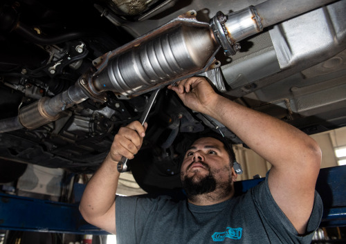 Carlos Juan Hernandez replaces a catalytic converter on a 2001 Honda Accord at Anchor Muffler in Anaheim, CA on Friday, December 14, 2018. A catalytic converter is a emission control device on a cars muffler. (Photo by Paul Bersebach, Orange County Register/SCNG)