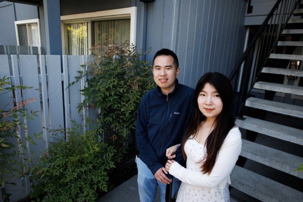 Chris Lee and his wife, Betty Li, at their new apartment unit in San Jose, Calif., on Tuesday, May 7, 2024. (Dai Sugano/Bay Area News Group)