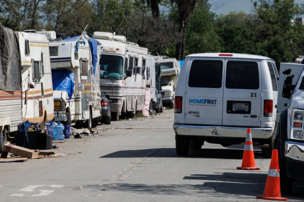 Homeless services non-profit HomeFirst's van is seen at the homeless encampment near Columbus Park in San Jose, Calif., on Friday, April 12, 2024. (Dai Sugano/Bay Area News Group)