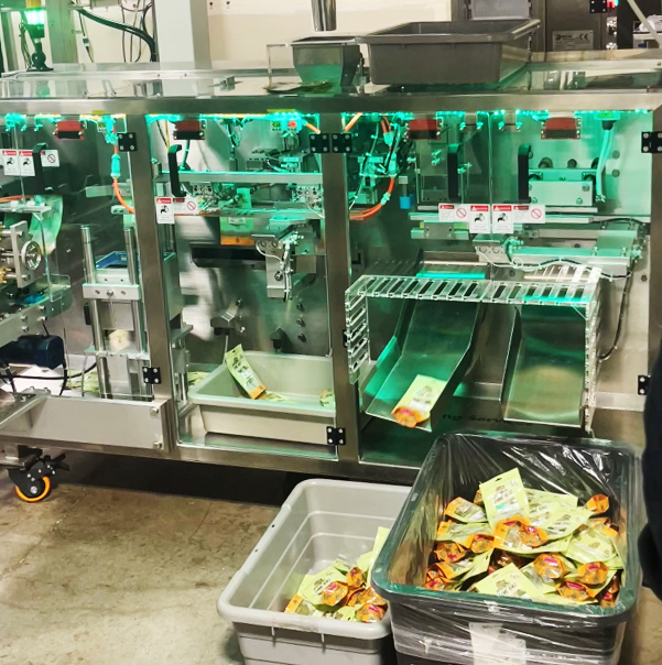 StateHouse Holdings continues to invest in automation across all their facilities including this one in Greenfield. The automated bagger shown above has helped improve the overall output and standardization of their house cannabis flower brands like "Dime Bag."(Photo courtesy of StateHouse Holdings)