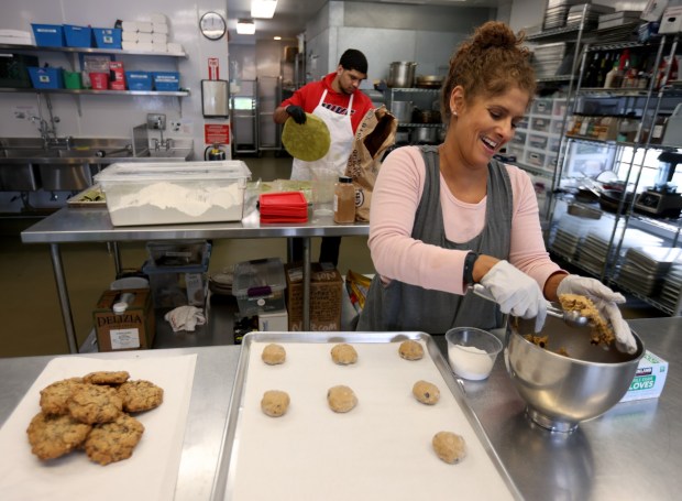 Sonya Ginsburg prepares cookie orders at The Lafayette Kitchen in Lafayette, Calif., on Tuesday, April 23, 2024. Ginsburg makes specialty cookies to order. (Jane Tyska/Bay Area News Group)