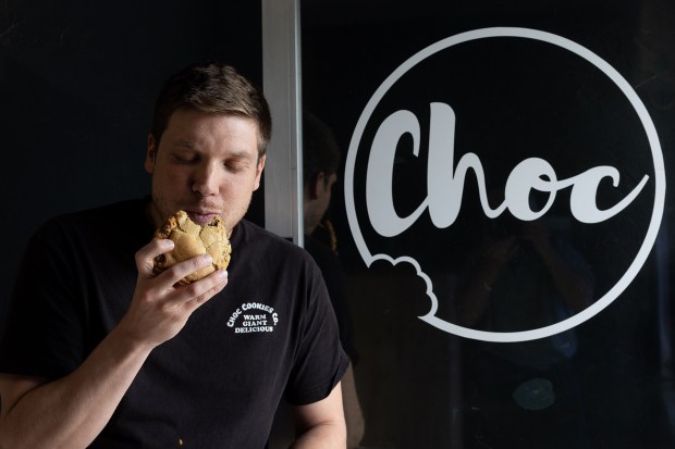 Matthew Hale, owner of Choc Cookies in Santa Clara, Calif., shows off one of his signature chocolate chip cookies, Wednesday, April 24, 2024. (Karl Mondon/Bay Area News Group)