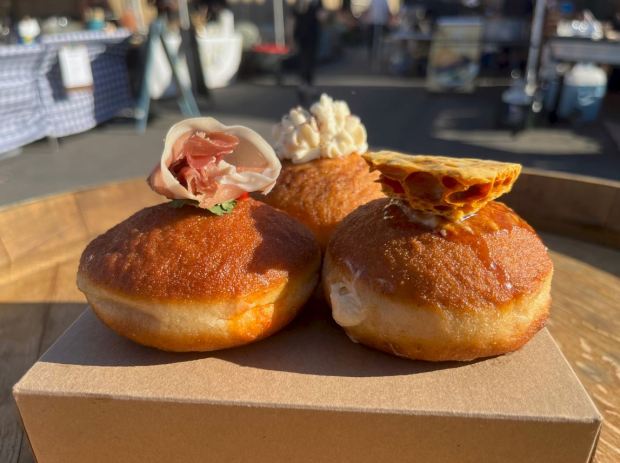 SoDo Donuts makes sourdough donuts with locally sourced dairy and fruits. Pictured: Savory Red Pepper and Chevre with Prosciutto (left), Burnt Honey Cream (right) and Mexican Hot Chocolate Custard. (John Metcalfe/Bay Area News Group)