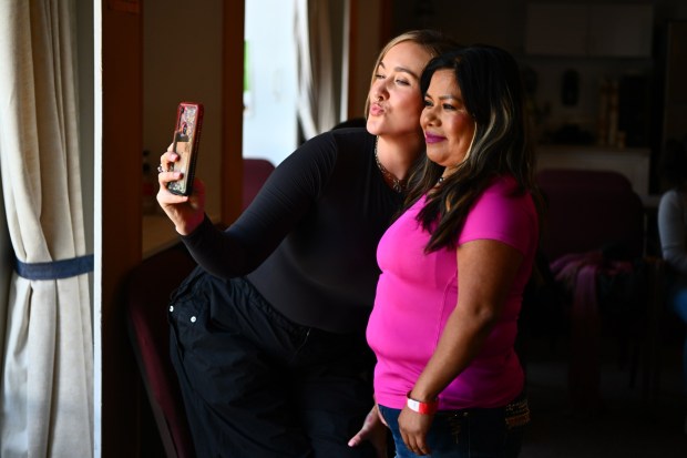 Margarita Clemente, of Hollister, poses for a selfie with makeup artist Mariana McGrath after getting her make up done during the Farmworker Caravan Conference and Retreat held at the Saint Francis Retreat Center in San Juan Bautista, Calif., on Sunday, May 19, 2024. Over 50 stylists, barbers and make up artists will gathered today to treat farmworkers to make overs, offering a rare luxury to the largely low-income individuals. This week marks the second time that the event has been held. (Jose Carlos Fajardo/Bay Area News Group)