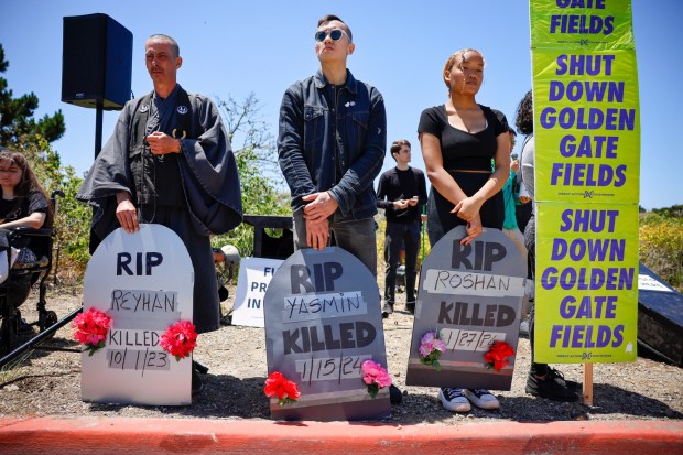 Protesters of Golden Gate Fields from Direct Action Everywhere stand along Buchanan Street outside of Golden Gate Fields in Albany, Calif., on Sunday, June 9, 2024. (Nhat V. Meyer/Bay Area News Group)