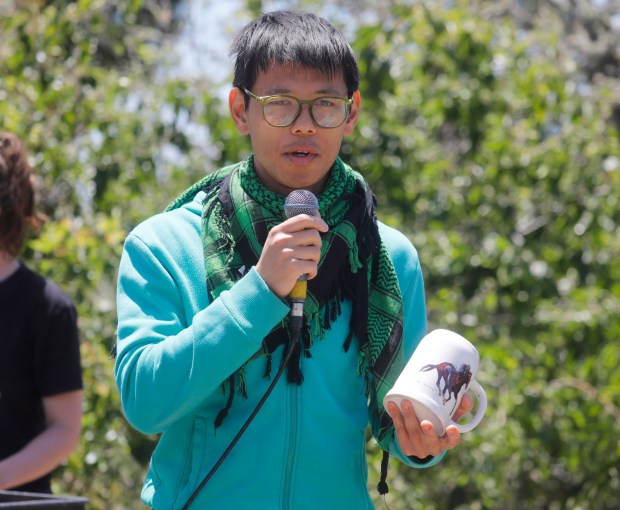 Rocky Chau, with Direct Action Everywhere, speaks during a protest of Golden Gate Fields along Buchanan Street outside of Golden Gate Fields in Albany, Calif., on Sunday, June 9, 2024. (Nhat V. Meyer/Bay Area News Group)