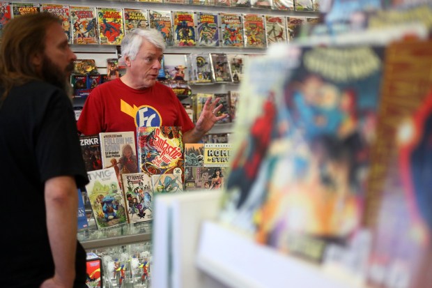 CONCORD, CALIFORNIA - NOVEMBER 16: Flying Color Comics owner Joe Field, right, visits with customers at his shop on Wednesday, Nov. 16, 2022, in Concord, Calif. (Aric Crabb/Bay Area News Group)