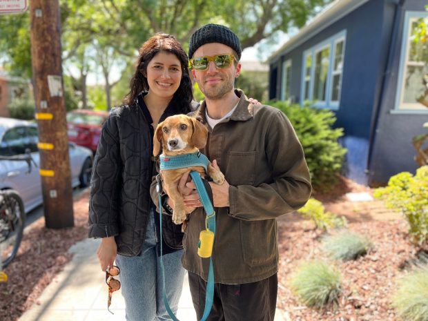 Kenny Handel and Amanda Piñero stand outside of an open house they toured in Rockridge on May 25, 2024. They have been browsing for homes in the area for the last few months, but have been deterred by high interest rates.