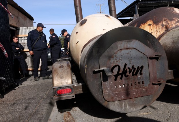 Oakland firefighters investigate the aftermath of a fire at Horn Barbecue in Oakland, Calif., on Wednesday, Nov. 22, 2023. A blaze gutted the restaurant early Tuesday morning. (Jane Tyska/Bay Area News Group)