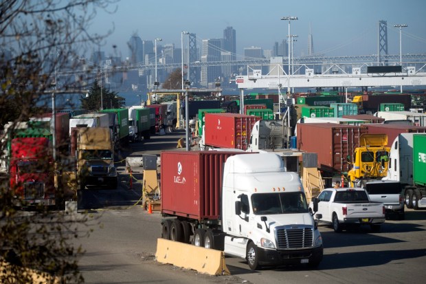 Trucks leave the Ben E. Nutter Terminal at the Port of Oakland, Calif., on Thursday, Oct. 22, 2015. (D. Ross Cameron/Bay Area News Group)