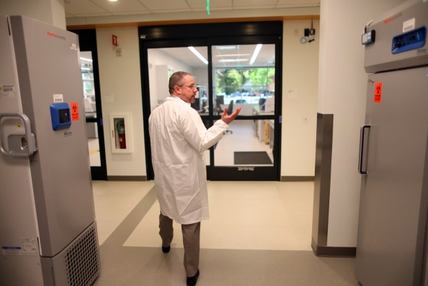 Doctor Jason Rosenbaum, a molecular genetic pathologistat at the Kaiser Permanente Northern California Regional Laboratory walks through a section fo the new facility on Monday, April 1, 2024, in San Jose, Calif. The new genomics lab will expand diagnostic testing capabilities and provide early screening and intervention for its 4.5 million members. (Aric Crabb/Bay Area News Group)