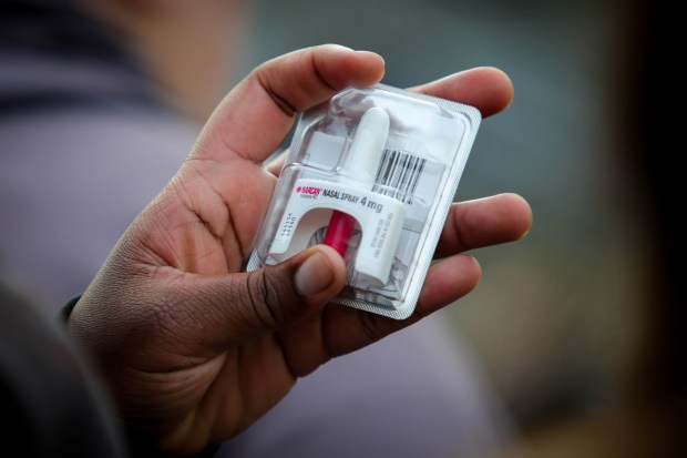 A teacher takes a closer look at Narcan nasal spray during a Narcan training session for John Swett Unified School District teachers at Rodeo Hills Elementary School in Rodeo, Calif., on Friday, Dec. 9, 2022. Teaches learned how to use it in the event of a fentanyl overdose to revive students. (Ray Chavez/Bay Area News Group)