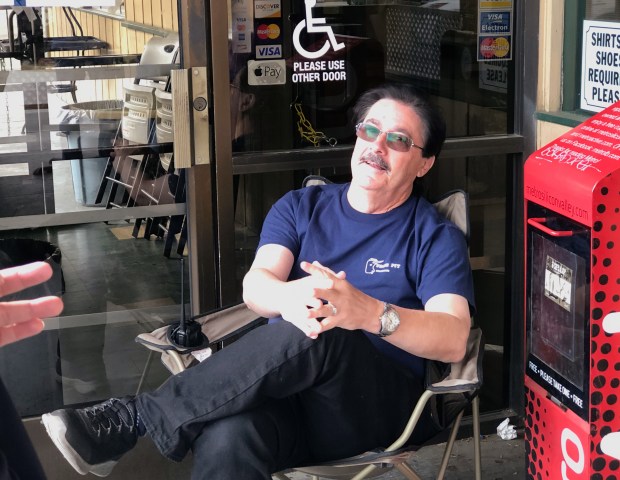 Kevin Ashford sits outside the Burger Pit on Blossom Hill Road, waiting for it to open on its last day of business, April 23, 2024. The chain started in 1953, and that Blossom Hill location opened in 1964. (Sal Pizarro/Bay Area News Group)