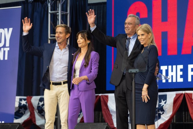 Independent presidential candidate Robert F. Kennedy Jr., and his wife Cheryl Hines share the stage with his just-announced running mate Nicole Shanahan and her partner Jacob Strumwasser at the Henry J. Kaiser Center for the Arts in Oakland, Calif., Tuesday, March 26, 2024. (Karl Mondon/Bay Area News Group)