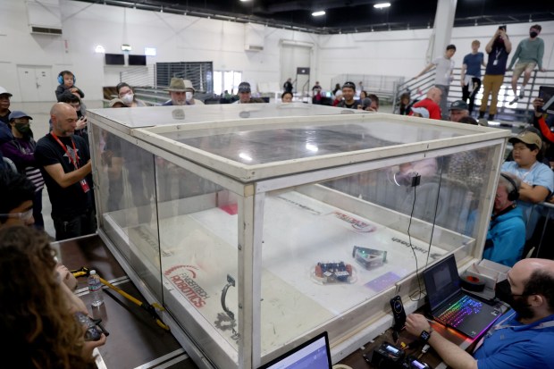 People compete in a crash contest with their robots during the RoboGames 2023 competition at the Alameda County Fairgrounds in Pleasanton, Calif., on Thursday, April 6, 2023. Both local and international participants competed in over 40 events at the 16th annual world championship. (Jane Tyska/Bay Area News Group)