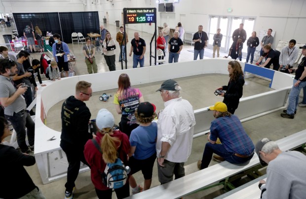 People compete in a robotic hockey game during the RoboGames 2023 competition at the Alameda County Fairgrounds in Pleasanton, Calif., on Thursday, April 6, 2023. Both local and international participants competed in over 40 events at the 16th annual world championship. (Jane Tyska/Bay Area News Group)