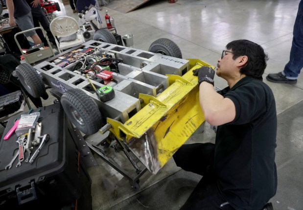 Gary Gin, of San Leandro, makes adjustments to his robotic combat car during the RoboGames 2023 competition at the Alameda County Fairgrounds in Pleasanton, Calif., on Thursday, April 6, 2023. Both local and international participants competed in over 40 events at the 16th annual world championship. (Jane Tyska/Bay Area News Group)