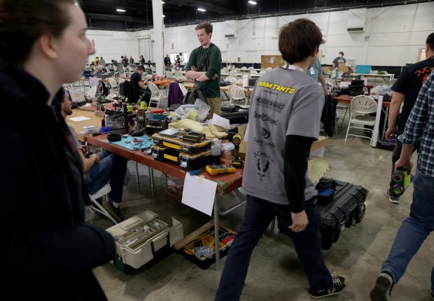 Participants tinker with their projects during the RoboGames 2023 competition at the Alameda County Fairgrounds in Pleasanton, Calif., on Thursday, April 6, 2023. Both local and international participants competed in over 40 events at the 16th annual world championship. (Jane Tyska/Bay Area News Group)