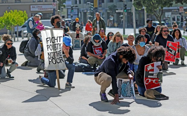 Homeless adovcates take part in a rally in front of the Phillip Burton Federal Building and U.S. Courthouse on Monday, April 22, 2024, in San Francisco, Calif. Over 60 people gathered at the federal court building to demand the Supreme Court keep current restrictions on clearing camps in place. (Aric Crabb/Bay Area News Group)