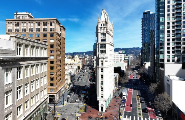 A drone view of the Cathedral Building, built in 1914, in downtown Oakland in March . According to a new School of Cities report produced by the University of Toronto, visits to downtown Oakland rose 20.6% in the past year. (Jane Tyska/Bay Area News Group)