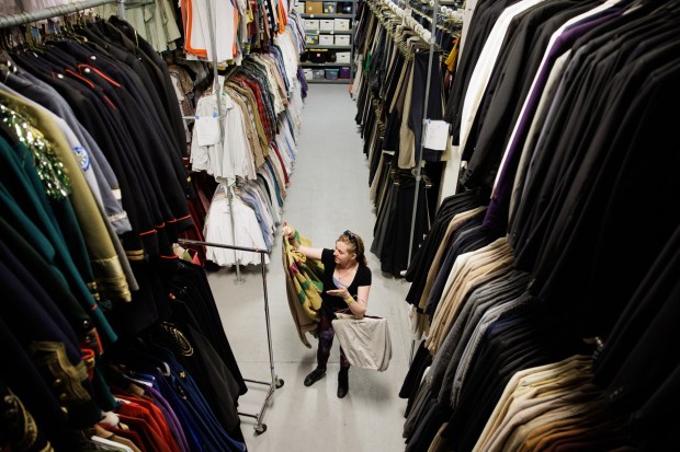 TheatreWorks Silicon Valley costume rentals manager Ren Geiselhart restocks costumes at TheatreWorks' headquarters in Redwood City, Calif., on Wednesday, Aug. 9, 2023. (Dai Sugano/Bay Area News Group)