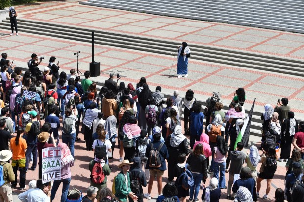 UC Berkeley law student Malak Afaneh speaks to a large crowd of pro-Palestinian protesters during a planned protest on the campus of UC Berkeley in Berkeley, Calif., on Monday, April 22, 2024. Hundreds of pro-Palestinian protesters staged a demonstration in front of Sproul Hall where they set up a tent encampment and are demanding a permanent cease-fire in the war between Israel and Gaza. (Jose Carlos Fajardo/Bay Area News Group)