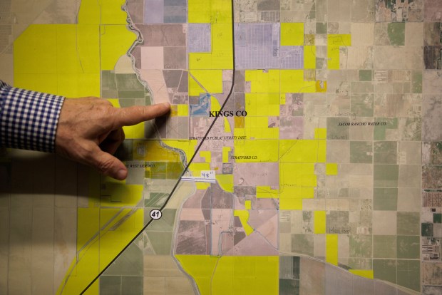 Prominent South Bay developer John Vidovich shows a map of Kings County with his Sandridge Partners' properties highlighted in yellow, on July 8, 2022, in his Los Altos office. (Dai Sugano/Bay Area News Group)