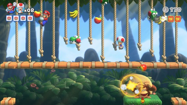 Mario battles Donkey Kong during a boss level